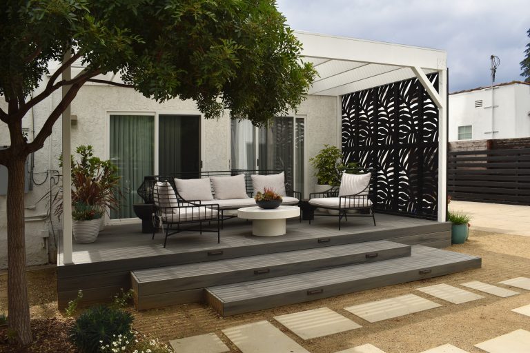The pergola creates a dappled shade to relax in and the decorative panels give much needed privacy from the neighbors.