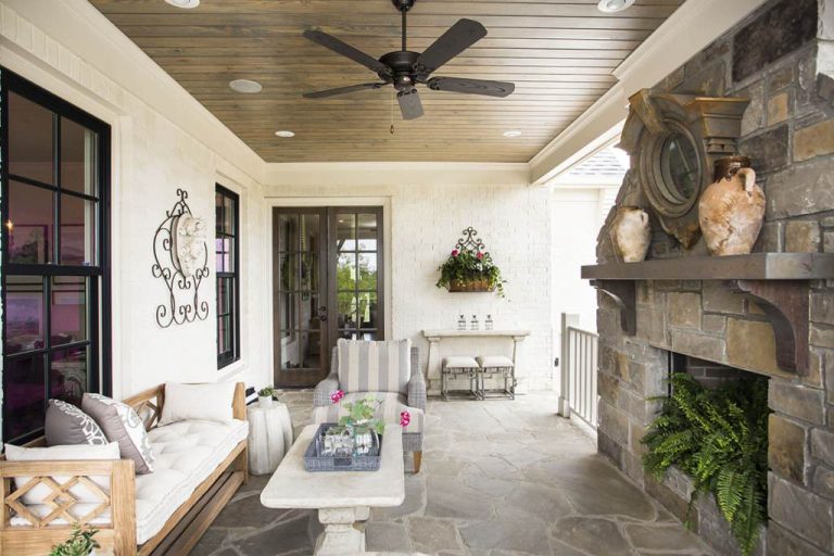 Mid-sized classic stone back porch idea in Little Rock with a fire pit and a roof extension by Providence Design | Outdoor Photos | Porch | Landscaping | Landscape Design | Outdoor Living Space | Porch Design Ideas | Outdoor Living Space Ideas | Backyard Design