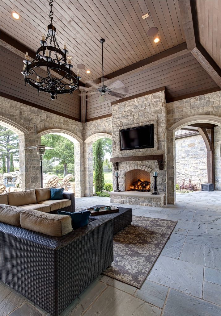 Tuscan porch idea in Dallas with a fire pit and a roof extension by Simmons Estate Homes | Outdoor Photos | Porch | Landscaping | Landscape Design | Outdoor Living Space | Porch Design Ideas | Outdoor Living Space Ideas | Backyard Design