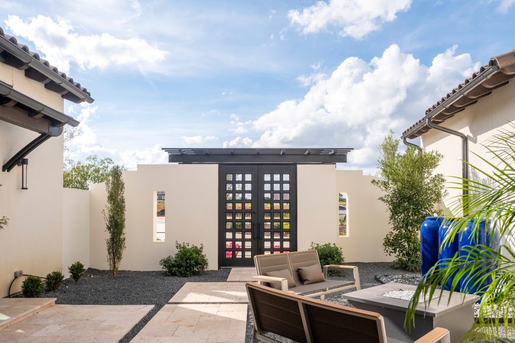 Mid-sized trendy courtyard tile patio photo in Dallas with a fire pit and no cover