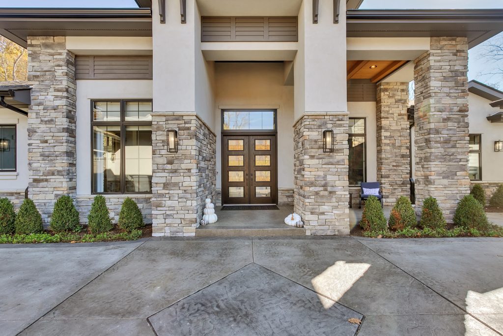 sprawling ranch estate home w/ stone and stucco exterior