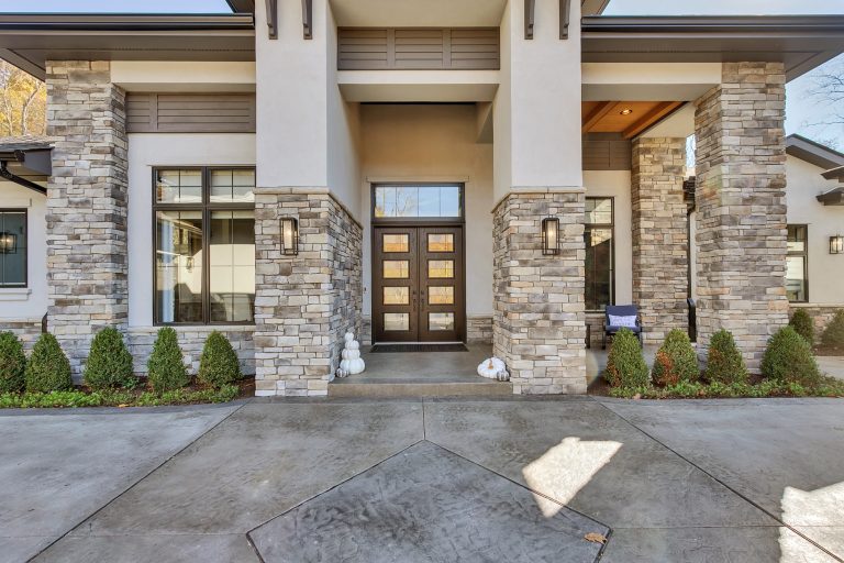 sprawling ranch estate home w/ stone and stucco exterior
