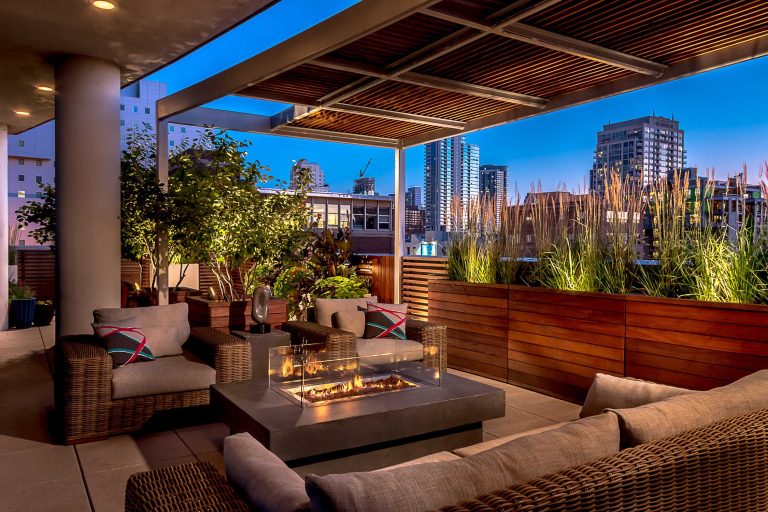 The city comes alive in the evening.

Photo courtesy Van Inwegen Digital ArtsDeck - mid-sized contemporary rooftop deck idea in Chicago with a fire pit by Chicago Specialty Gardens, Inc. | Fire Pits|Backyard Design|Outdoor Living Spaces|Landscape Design|Backyard Ideas|Landscaping|Landscaping Ideas|Landscape Installation|Fire Feautures|Fire Pit