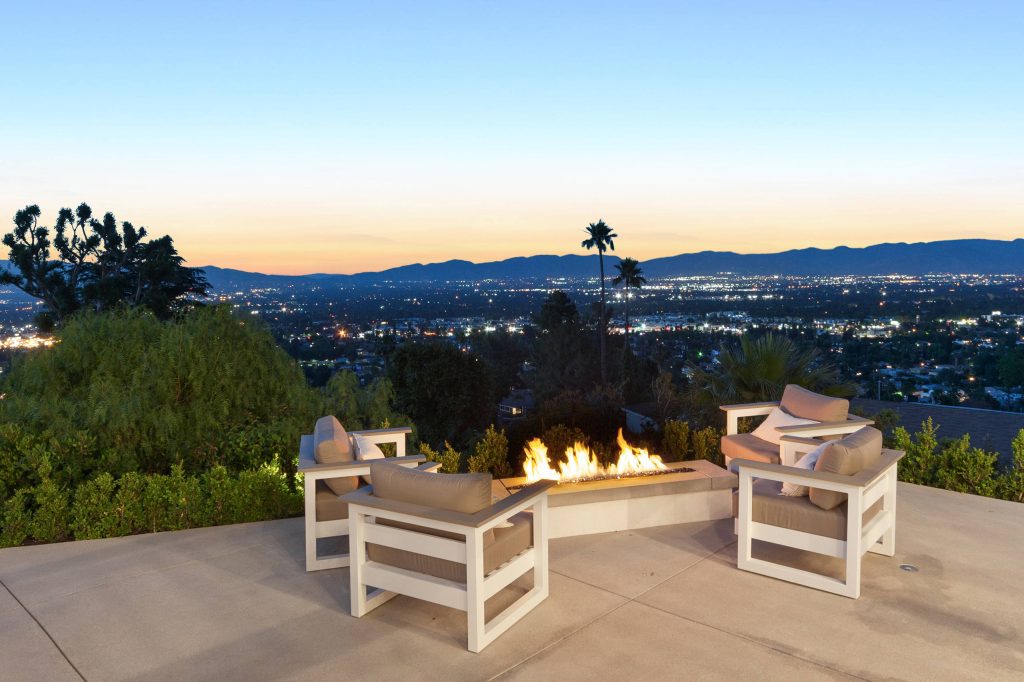 Custom build fire pit allowing for a relaxing time with city views.