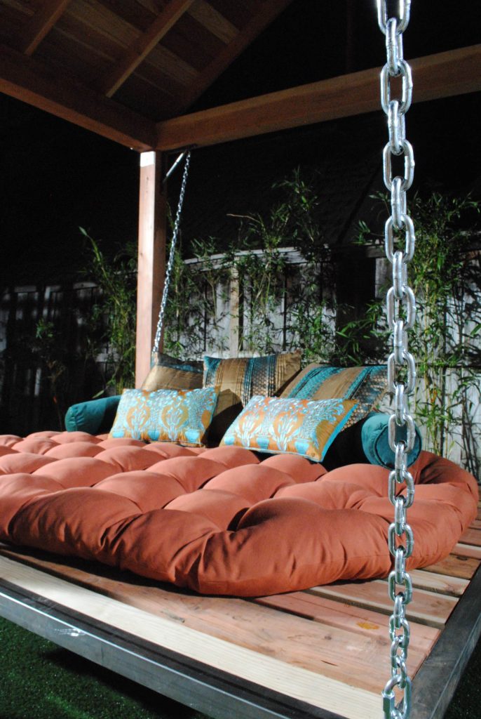 The inspiration was a Thai inspired retreat that offered comfortable lounging outdoors. The suspended outdoor bed displays an asian aesthetic while giving the lounger a zen floating sensation. This Hardscape offers great entertaining with outdoor lounging around a beautiful custom fire pit and a custom built-in barbecue kitchen.