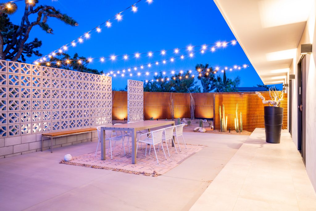 Inspiration for a mid-sized southwestern backyard concrete patio remodel in Other with no cover and a fire pit