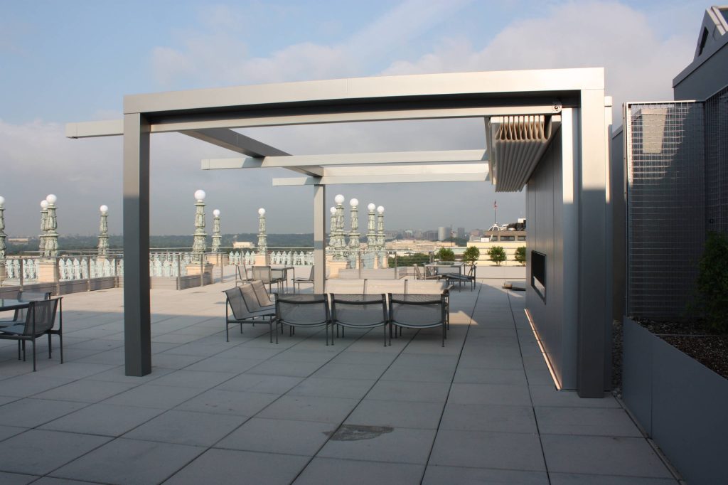 Our Rimini model was attached to a clients steel structure which was powder coated the same color as the guides. All our retractable patio cover systems are for excellent sun, uv and glare, heavy rain and even hail protection and are all Beaufort wind load approved. See the link below for the Rimini model. We offer 17 other retractable patio cover models.