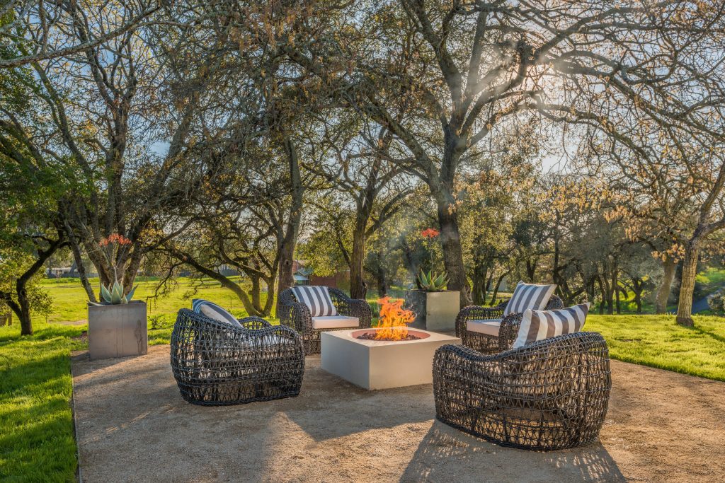 Patio - farmhouse backyard gravel patio idea in San Francisco with a fire pit