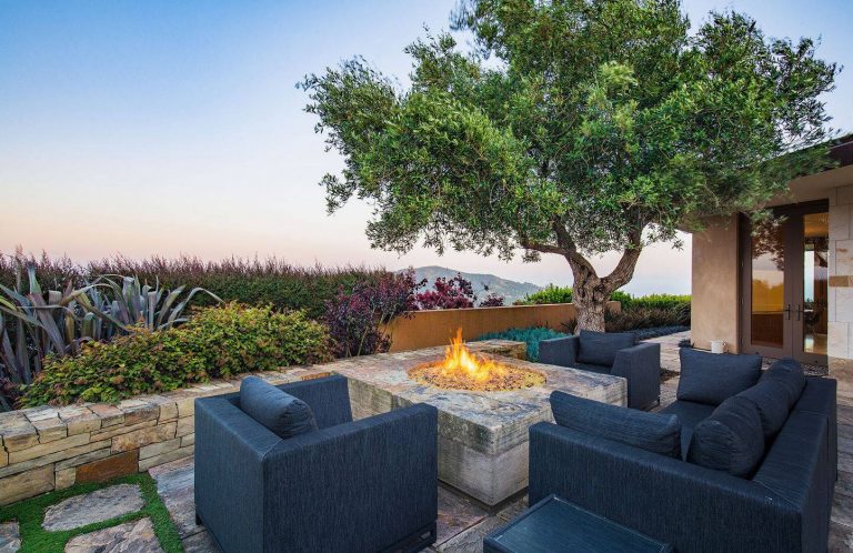 Example of a trendy patio design in San Francisco with a fire pit and no cover