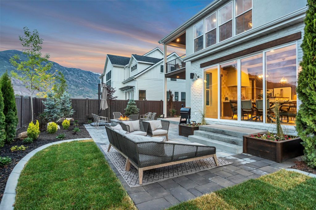 Inspiration for a contemporary backyard stone patio remodel in Salt Lake City with a fire pit and no cover