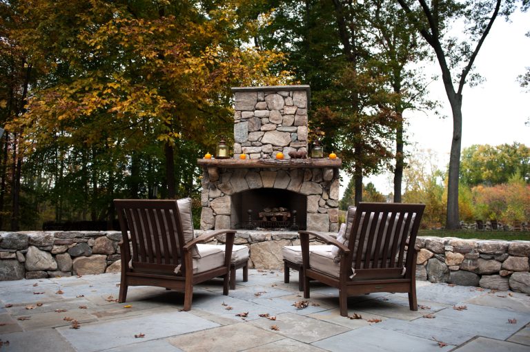 Elegant patio photo in Boston with a fire pit