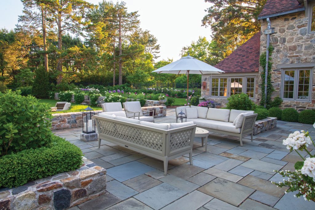 Example of a mid-sized arts and crafts backyard concrete paver patio design in New York with a fire pit and no cover