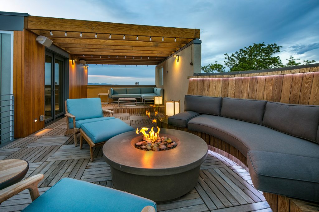 Roof terrace with gas fire pit. Deck is made from Buffalo ipe deck panels on pedestals. Siding is vertical 1x6 hemlock, shiplap.