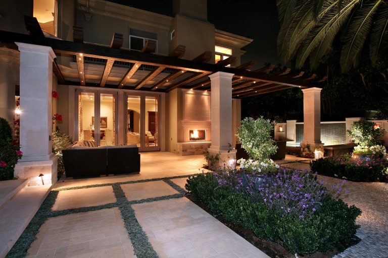Inspiration for a mediterranean backyard stone patio remodel in Orange County with a fire pit and a pergola