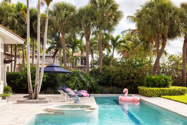 Our St. Pete studio designed this stunning home in a Greek Mediterranean style to create the best of Florida waterfront living. We started with a neutral palette and added pops of bright blue to recreate the hues of the ocean in the interiors. Every room is carefully curated to ensure a smooth flow and feel, including the luxurious bathroom, which evokes a calm, soothing vibe. All the bedrooms are decorated to ensure they blend well with the rest of the home's decor. The large outdoor pool is another beautiful highlight which immediately puts one in a relaxing holiday mood!
