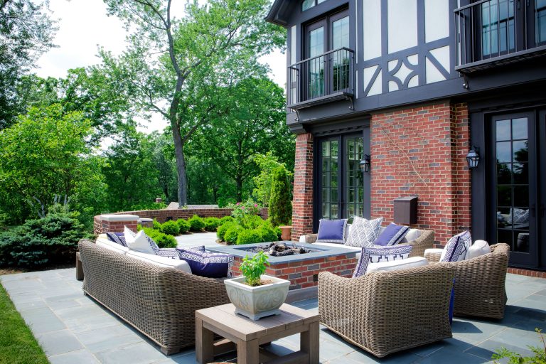 Example of a classic patio design in Other with a fire pit and no cover