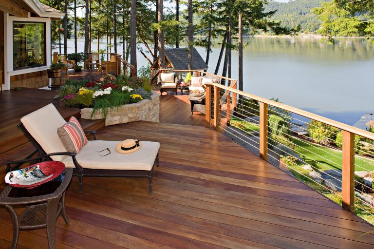 with the Puget Sound as a back drop this multilevel deck as Tiger decking, cable railing, with built in curved back benches